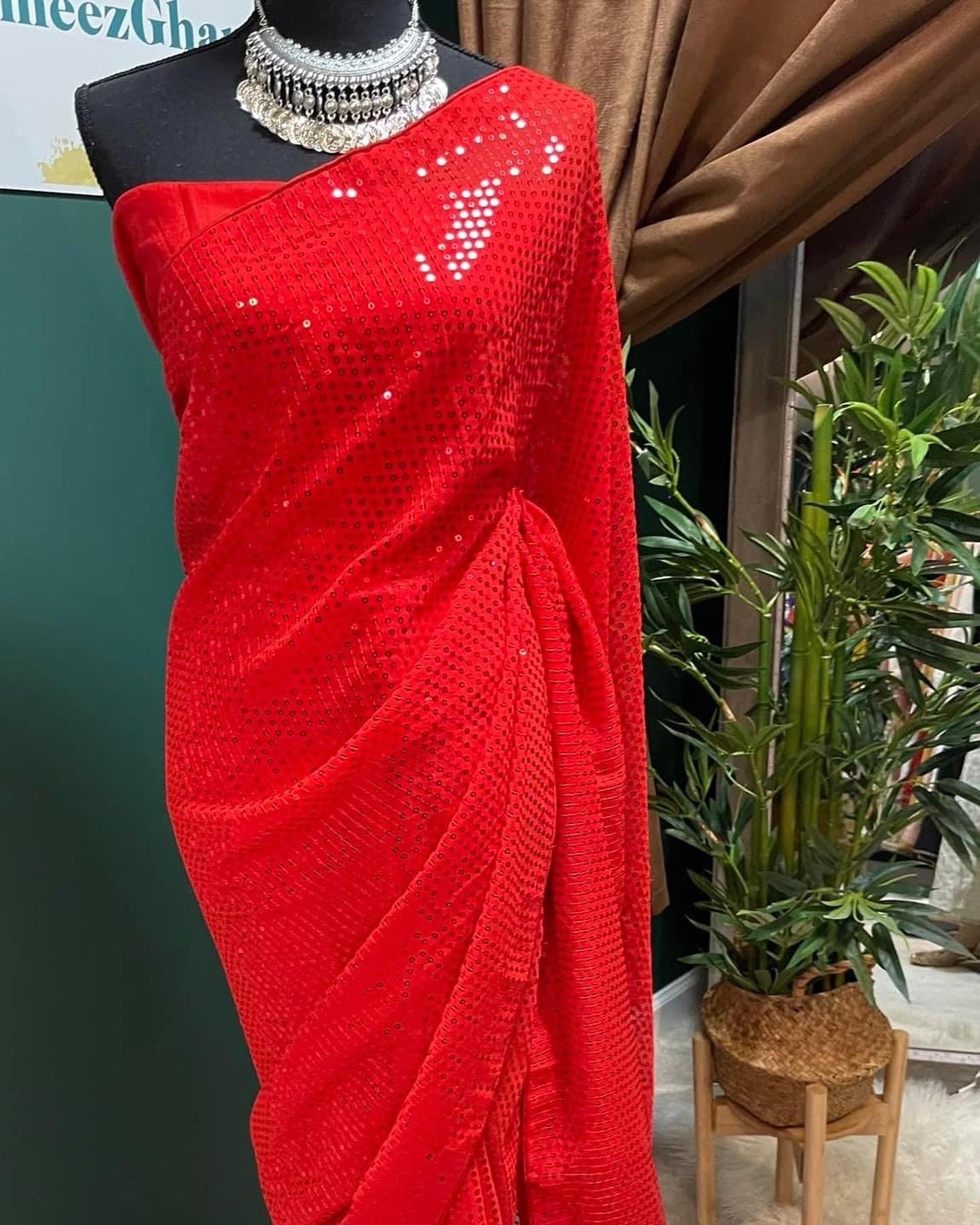 red sequins saree with unstitched blouse